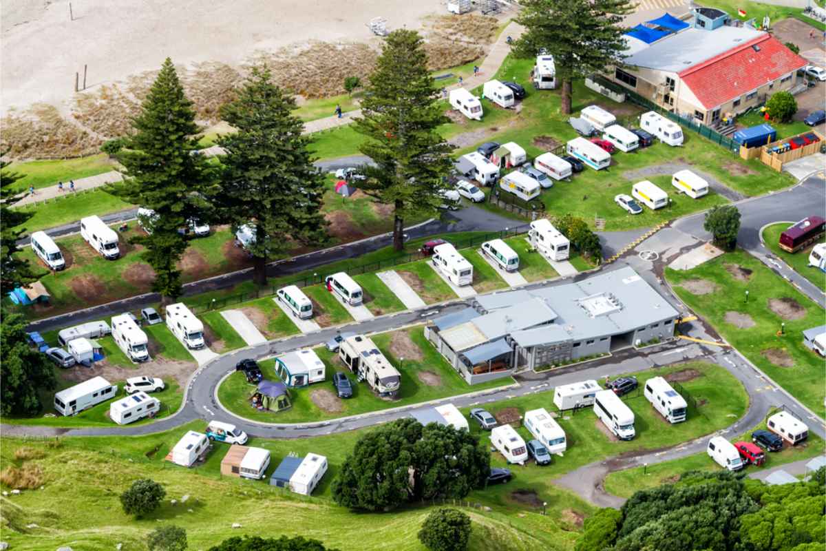 Aerial view of a campsite in NZ south Island with several campers and motorhomes parked